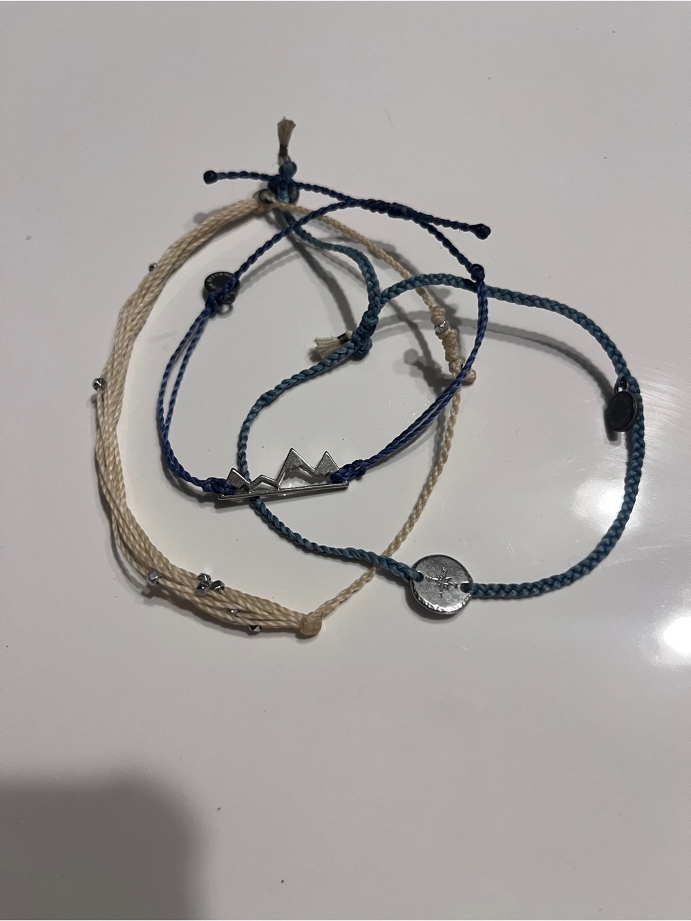Pura Vida stack Set of Three Braided String Bracelets in Blue and Cream